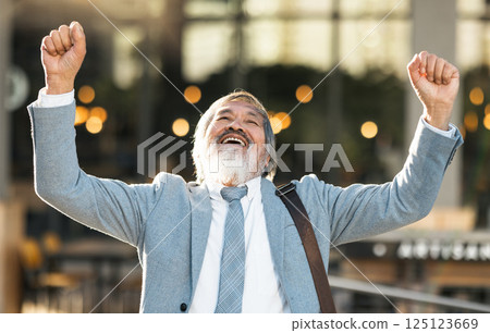 Senior businessman with success, winning and celebration for bonus, achievement and career goal. Elderly man entrepreneur, corporate worker or professional winner celebrate sale and profit outdoor 125123669