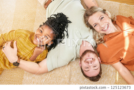 Happy, family and adoption portrait top view of caucasian mother and dad with black kid in house. Relax, interracial and smile of child together with foster mom and father in joyful home. 125123673