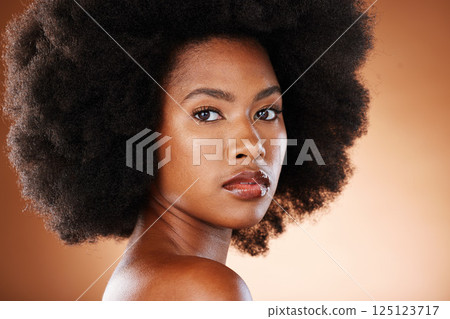 Beauty portrait of black woman with skincare, hair care and natural makeup for facial aesthetics, wellness and healthcare. Salon afro hair, cosmetics and face of model with glowing skin treatment Beauty portrait of black woman with skincare, hair care and natural makeup for facial aesthetics, wellness and healthcare. Salon afro hair, cosmetics and face of model with glowing skin treatment 125123717