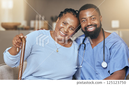 Nurse, senior black woman and doctor or caregiver hugging for support, love and gratitude in nursing home. Smile, healthcare worker and happy African elderly person with a cane for a disability 125123750