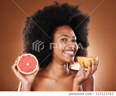 Beauty, skincare and grapefruit with portrait of black woman for vitamin c, nutrition and health. Wellness, diet and citrus product with girl model and fruit for cosmetics, collagen and natural detox 125123763
