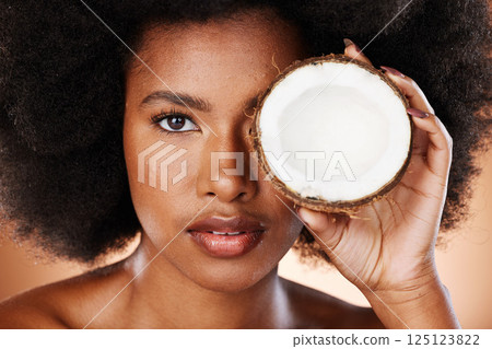 Beauty, skincare and black woman with coconut for a cosmetic healthcare product, healthy skin treatment and natural wellness. Organic health portrait, clean diet and self care nutrition studio mockup Beauty, skincare and black woman with coconut for a cosmetic healthcare product, healthy skin treatment and natural wellness. Organic health portrait, clean diet and self care nutrition studio mockup 125123822