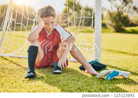 Sports, football loss and child sad over fitness game defeat, training competition fail or athlete contest. Kid depression, mental health problem and youth player depressed from soccer field bullying Sports, football loss and child sad over fitness game defeat, training competition fail or athlete contest. Kid depression, mental health problem and youth player depressed from soccer field bullying 125123891