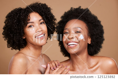 Skincare, portrait and women in studio for face, cream and product, beauty and wellness on brown background. Friends, black woman and facial, dermatology and luxury cosmetics, skin and hygiene mockup Skincare, portrait and women in studio for face, cream and product, beauty and wellness on brown background. Friends, black woman and facial, dermatology and luxury cosmetics, skin and hygiene mockup 125123892