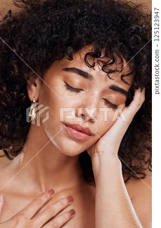 Woman face and skincare beauty, hair care and makeup with natural cosmetics with glow in brown studio background. Healthy skin, model and cosmetic facial with wellness, beautiful and curly glow Woman face and skincare beauty, hair care and makeup with natural cosmetics with glow in brown studio background. Healthy skin, model and cosmetic facial with wellness, beautiful and curly glow 125123947