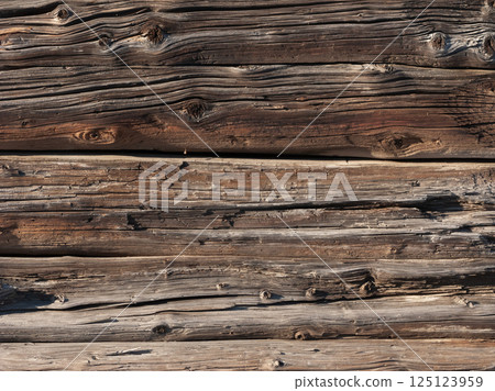 Old weathered log wall background 125123959