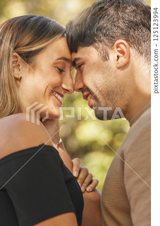 Couple, love and nature park while outdoor for quality time, commitment and trust being intimate, happy and intimate. Face of man and woman travel together to hug, kiss and relax on vacation 125123994
