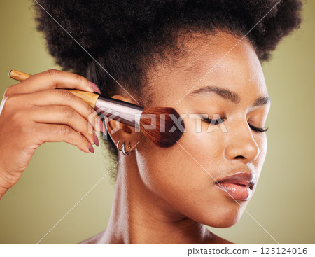 Beauty, black woman with makeup and cosmetic brush and product, face closeup against studio background. Cosmetics tool, foundation and facial, manicure and microblading for wellness and skincare. 125124016