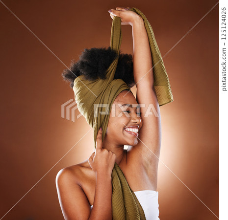 Beauty, face and black woman with hair scarf in studio on brown background mockup. Hair care, wellness or happy female model with eyes closed and fabric head wrap for afro hair or unique hair style 125124026