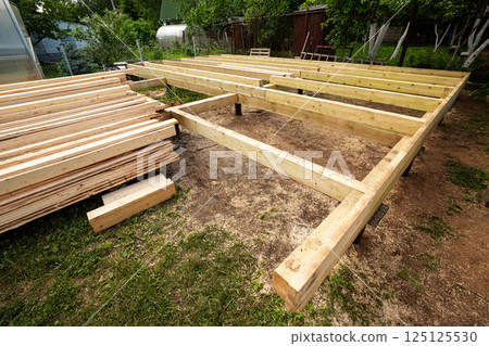 Wooden frame house foundation on screw piles 125125530