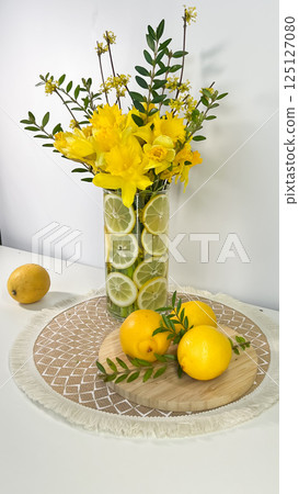 Bright still life with lemons and daffodils. Bright still life with lemons and daffodils. 125127080