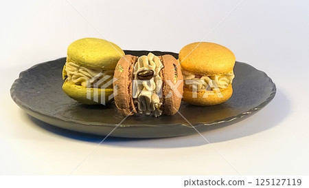 A Beautifully Colorful Arrangement of Macarons on a Decorative Plate Truly a Delightful Treat A Beautifully Colorful Arrangement of Macarons on a Decorative Plate Truly a Delightful Treat 125127119