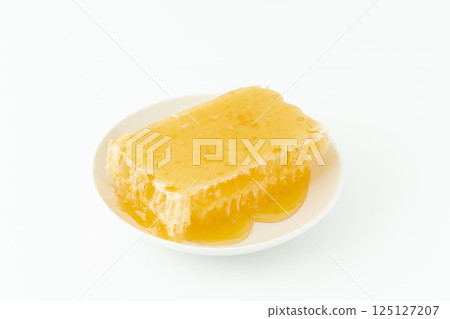 盤子上的蜂巢蜜 125127207