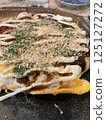 Oyster okonomiyaki cooked on a hot plate 125127272