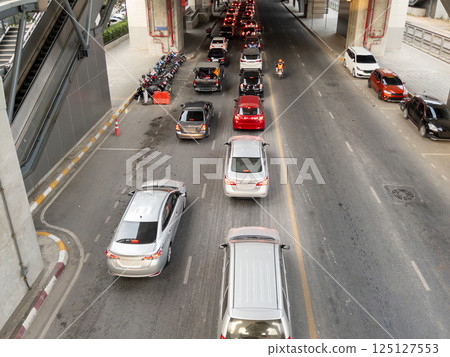 Urban Traffic Jam Under Elevated Train Station. Urban Traffic Jam Under Elevated Train Station. 125127553