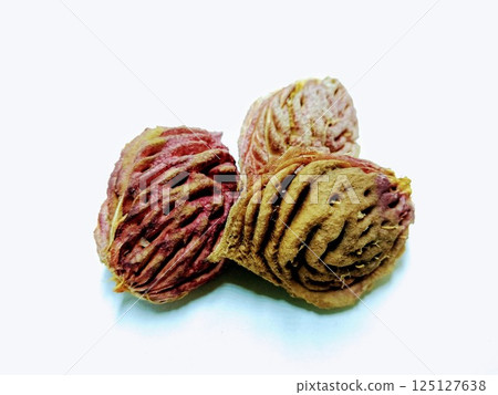 A picture of peach seeds isolated on a white background A picture of peach seeds isolated on a white background 125127638