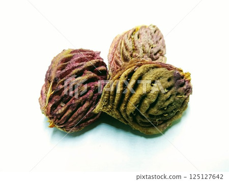 A picture of peach seeds isolated on a white background 125127642