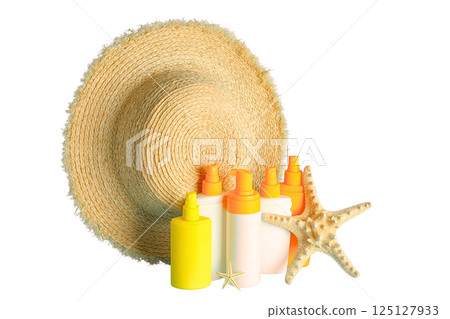 Sunscreen bottles and a straw hat prepare for fun summer activities, isolated on white Sunscreen bottles and a straw hat prepare for fun summer activities, isolated on white 125127933