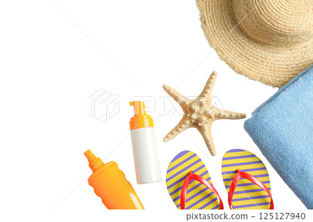 Sunscreen, a straw hat, and flip-flops arranged for summer fun, isolated on white Sunscreen, a straw hat, and flip-flops arranged for summer fun, isolated on white 125127940