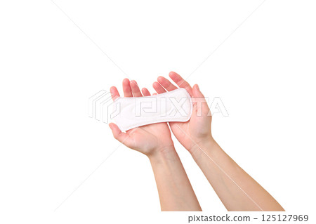 Feminine hygiene and menstruation, Hands holding a sanitary pad, showing feminine hygiene, isolated on white, PNG 125127969