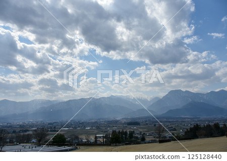 Superb view of Shinshu in spring, Northern Alps with remaining snow Superb view of Shinshu in spring, Northern Alps with remaining snow 125128440
