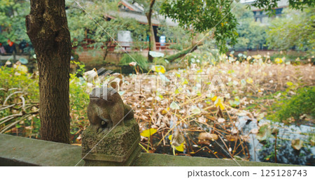 Chengdu, Sichuan, China. Old Stone Sculptures Of Frog At Park Of Wuhou Memorial Temple. Traditional Chinese Architectural Ornament. Image Of Frog In Chinese Culture Symbolizes Water And Rain Chengdu, Sichuan, China. Old Stone Sculptures Of Frog At Park Of Wuhou Memorial Temple. Traditional Chinese Architectural Ornament. Image Of Frog In Chinese Culture Symbolizes Water And Rain 125128743