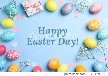 Easter, text: "Happy Easter" with eggs and gift, on a blue background 125129112