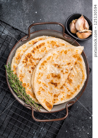 Aloo Paratha Indian Potato stuffed Flatbread. black background. top view 125130594