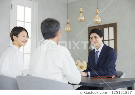 Salesman, senior and family having a meeting 125131837