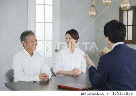 Salesman, senior and family having a meeting Salesman, senior and family having a meeting 125131839