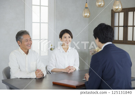 Salesman, senior and family having a meeting Salesman, senior and family having a meeting 125131840