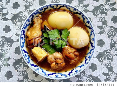 Boiled eggs. Thai food. Traditional Asian Chicken Dish with Boiled Eggs and Fresh Herbs Boiled eggs. Thai food. Traditional Asian Chicken Dish with Boiled Eggs and Fresh Herbs 125132444