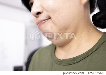 fat woman with double chin 125132568