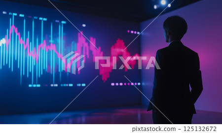 Businessman looking at a rising stock price chart 125132672
