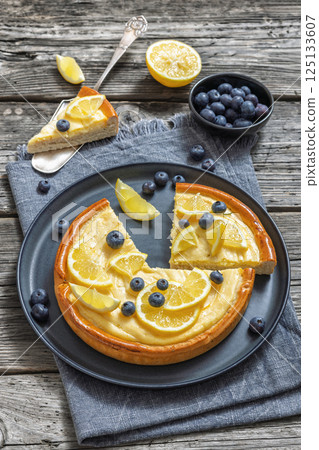 Cheesecake with blueberries sliced on a plate 125133607