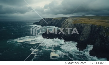 Dramatic coastal cliffs under a cloudy sky. 125133656