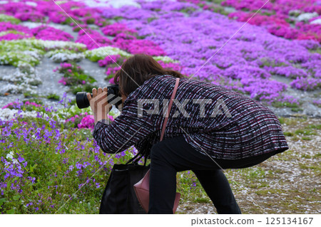 A timid senior photographer A timid senior photographer 125134167