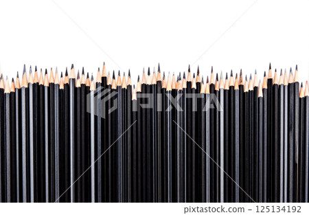 Black pencils standing upright on white background, sharp graphite tips, vertical arrangement, back to school, stationery supplies, minimal style, creative tools Black pencils standing upright on white background, sharp graphite tips, vertical arrangement, back to school, stationery supplies, minimal style, creative tools 125134192
