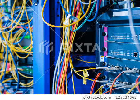 detail of server rack with fiber optic cables attached to front detail of server rack with fiber optic cables attached to front 125134562