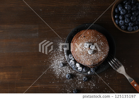 Chocolate pancakes, tasty breakfast, concept of delicious food, space for text Chocolate pancakes, tasty breakfast, concept of delicious food, space for text 125135197