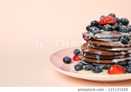 Chocolate pancakes, tasty breakfast, concept of delicious food, space for text 125135208