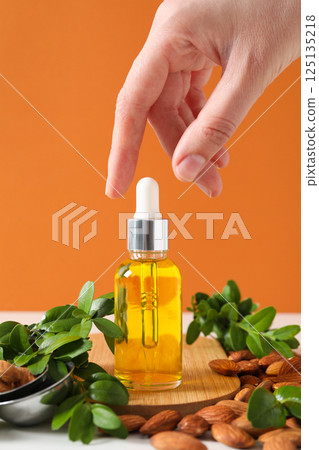 Almonds oil, concept of different cosmetic and skin care accessories Almonds oil, concept of different cosmetic and skin care accessories 125135218