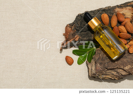 Almonds oil, concept of different cosmetic and skin care accessories 125135221