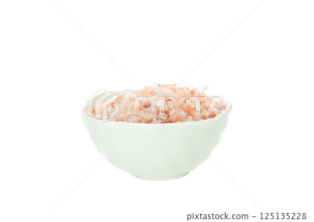 Pink sea salt in bowl on white background, close up 125135228