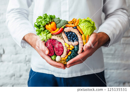 A man holds his stomach, symbolizing gut health and digestion. A glowing illustration of gut flora overlays his abdomen, representing probiotics and digestive wellness 125135531