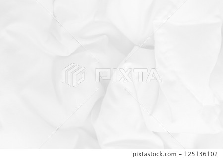 Close up top view of white bedding sheet and wrinkle messy blanket in bedroom after wake up in the morning. Close up top view of white bedding sheet and wrinkle messy blanket in bedroom after wake up in the morning. 125136102