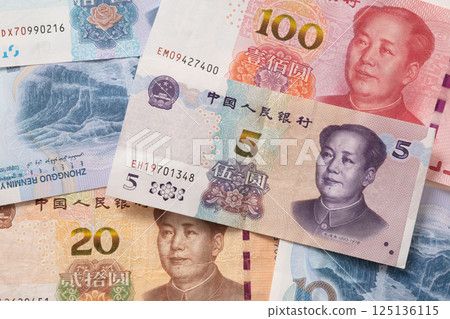 Many of different Chinese yuan banknotes. Chinese paper currency Yuan renminbi banknotes as background. 125136115