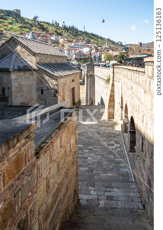 Metekhi church of the Nativity of the Mother of God on a cliff above Mtkvari river in Tbilisi, Georgia 125136163