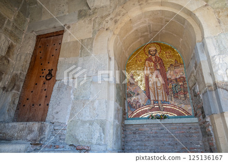 Religious detail at the Metekhi church of the Nativity of the Mother of God on a cliff above Mtkvari river in Tbilisi, Georgia 125136167