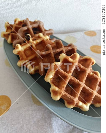 Freshly baked handmade waffles Freshly baked handmade waffles 125137392